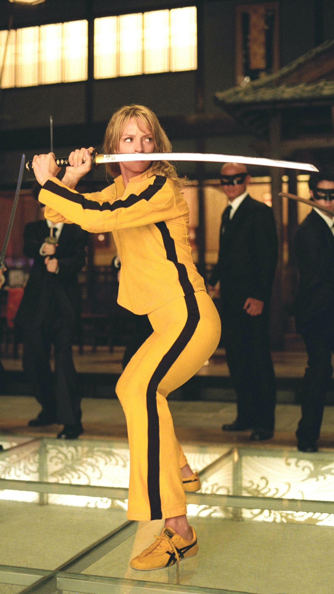 uma thurman wears a yellow tracksuit and onitsuka tiger mexico 66 sneakers in Kill Bill