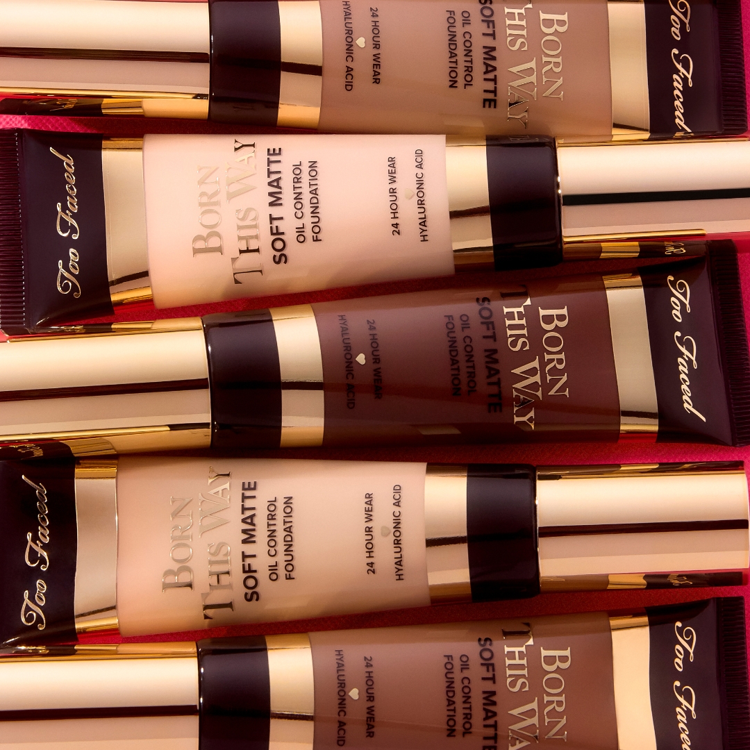 too faced born this way foundations stacked against a red background