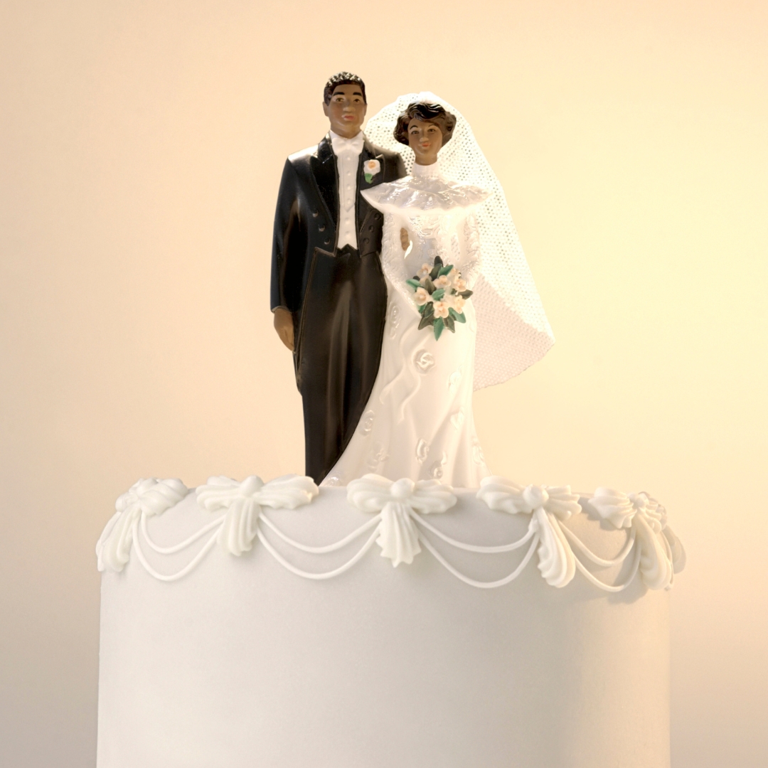 wedding cake toppers (image: taking your partner's name pros cons)